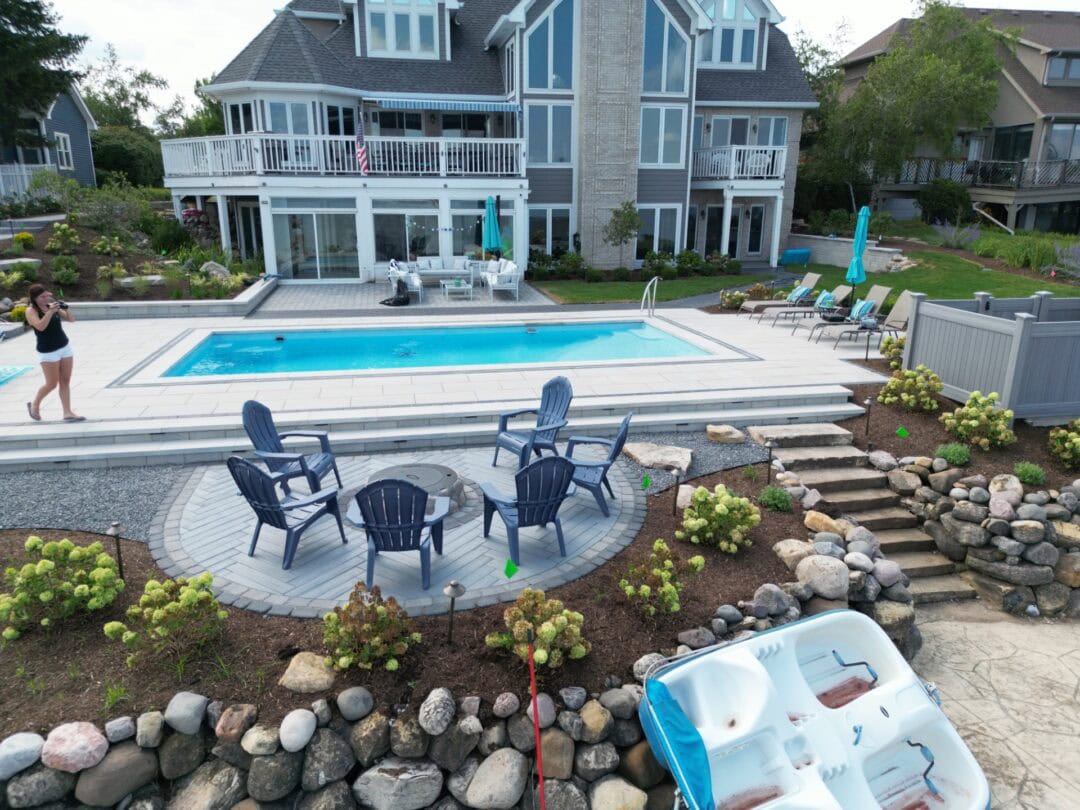 Backyard view with pool and seating area