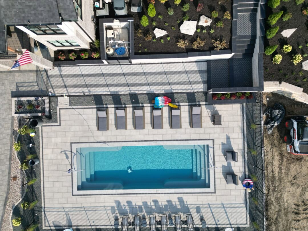 Aerial view of modern backyard pool area