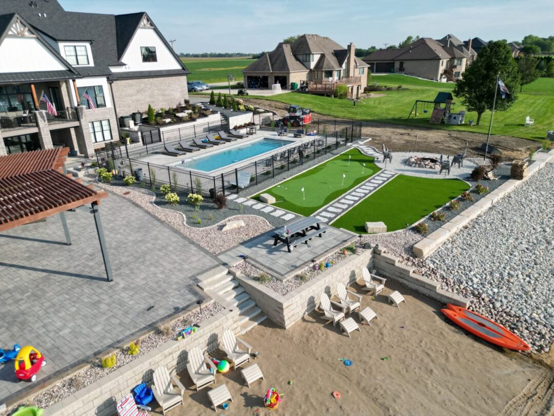 Aerial view of luxury backyard with pool.