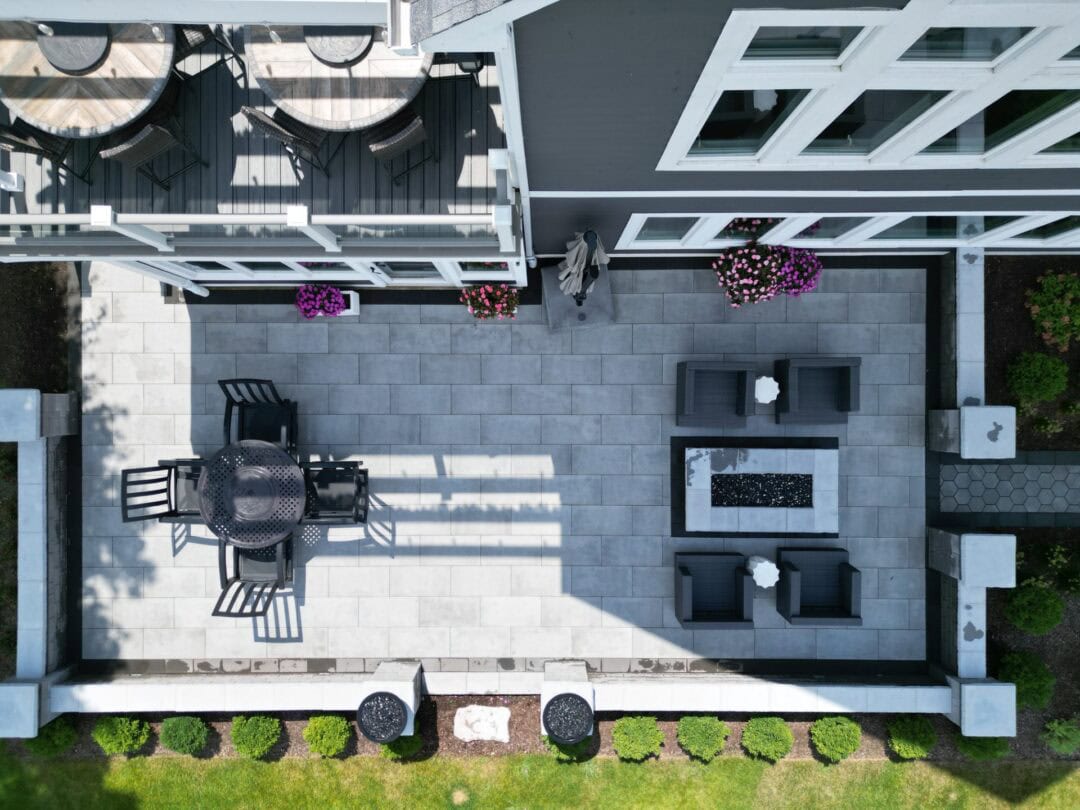 Aerial view of patio and deck with furniture