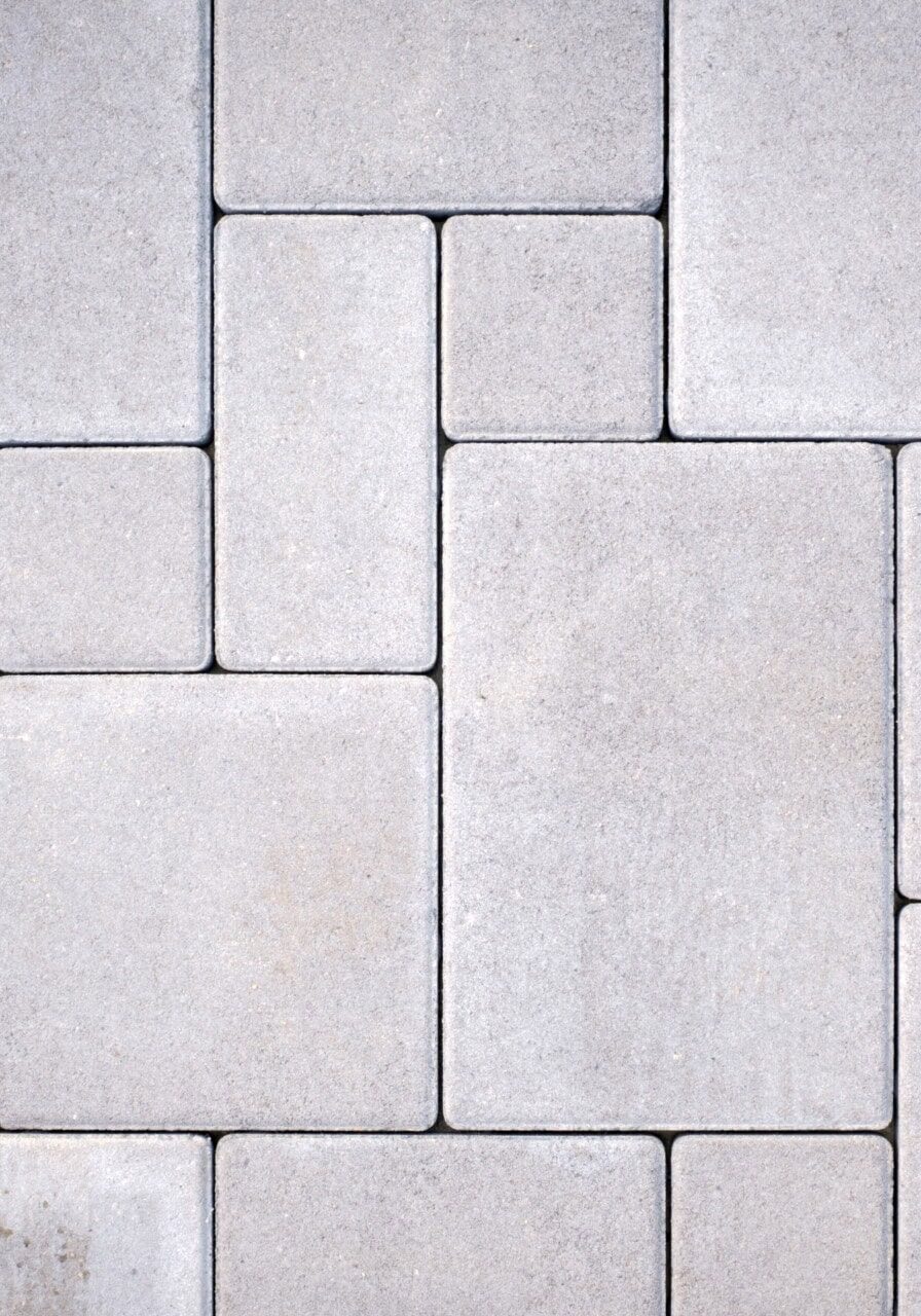 Gray concrete paving stones pattern close-up.