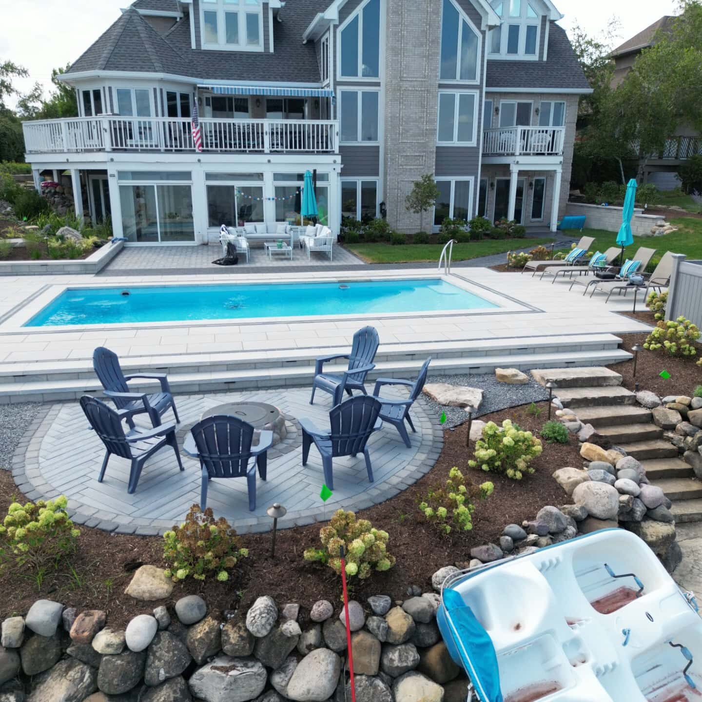 Backyard view with pool and seating area