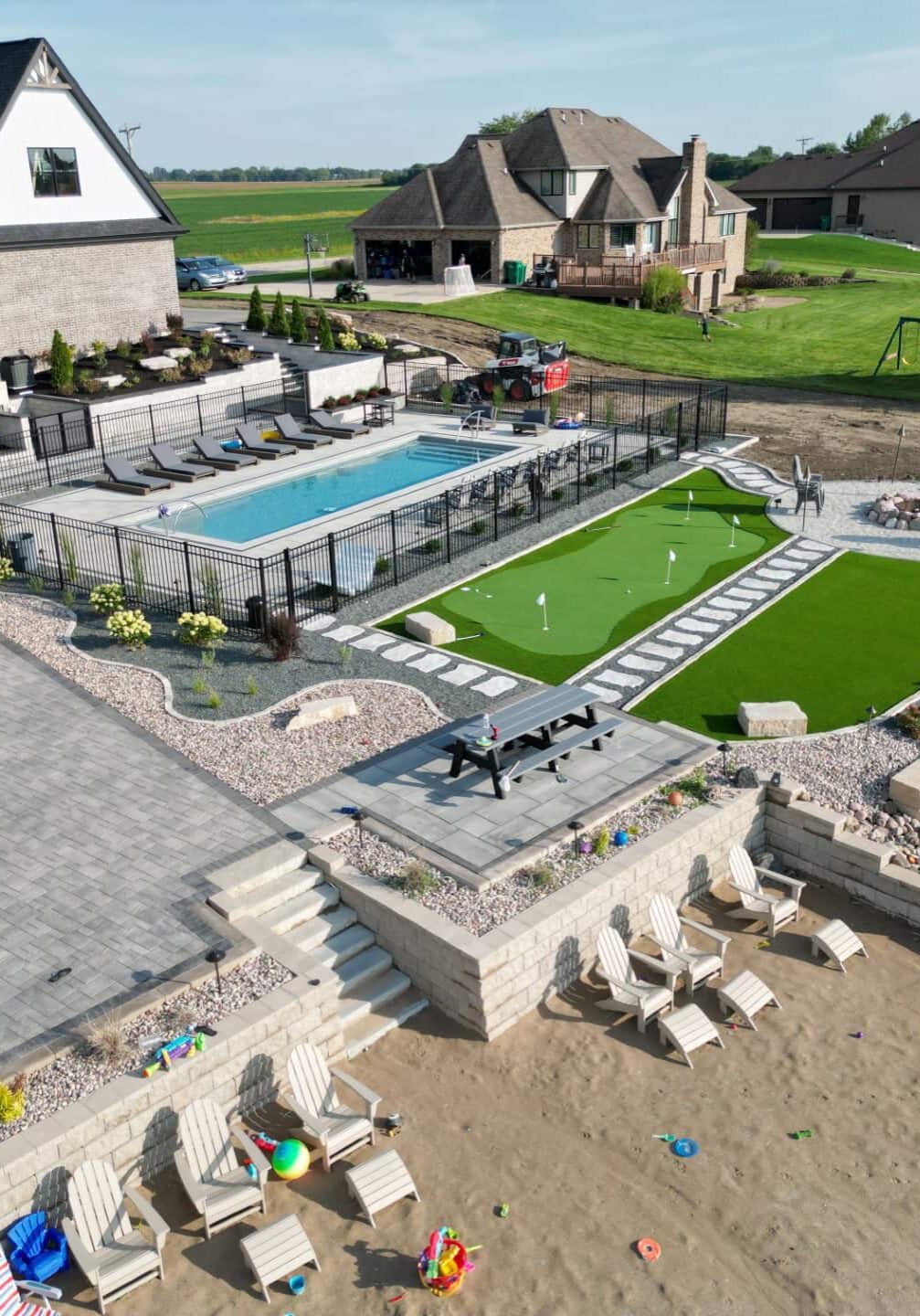 Aerial view of luxury backyard with pool.