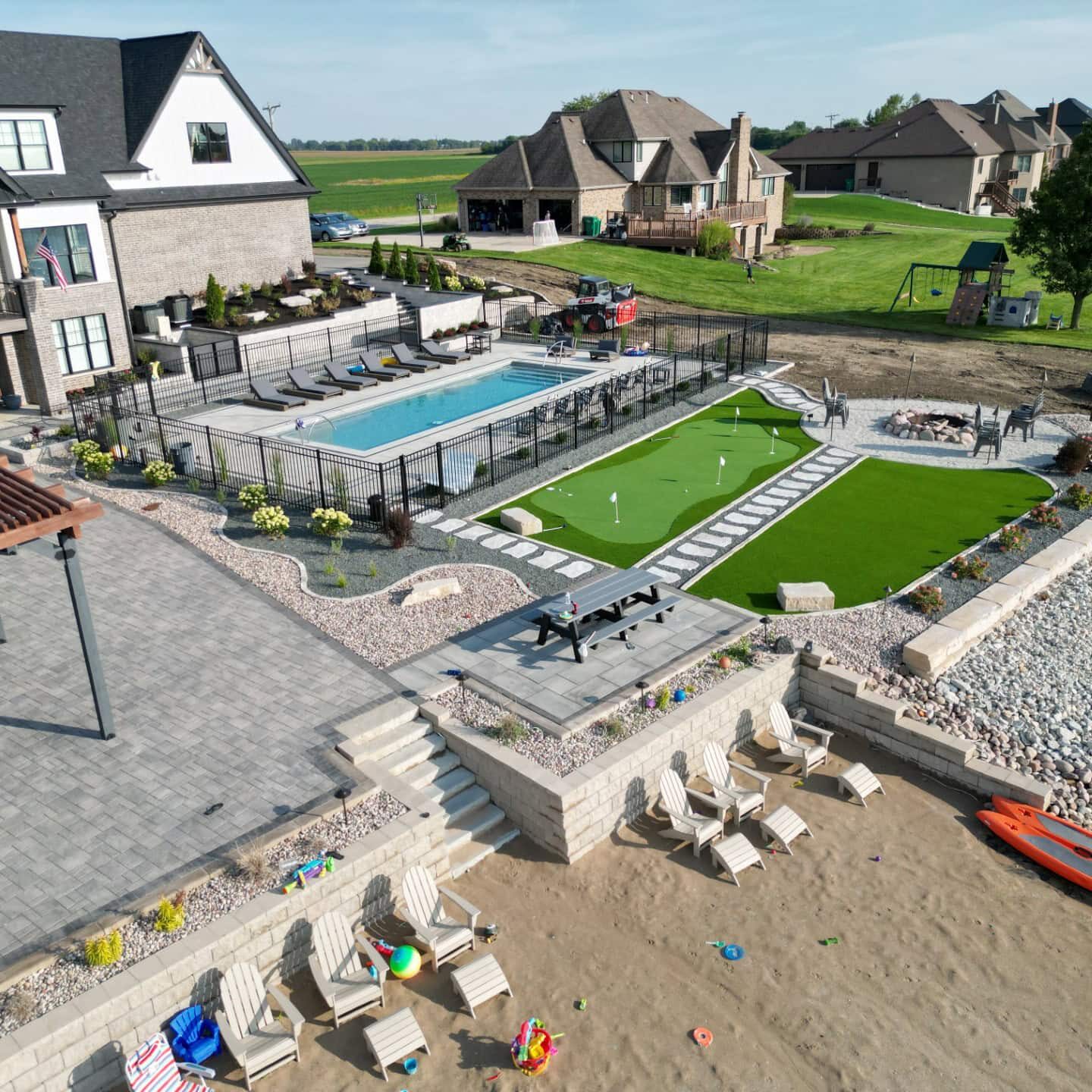 Aerial view of luxury backyard with pool.