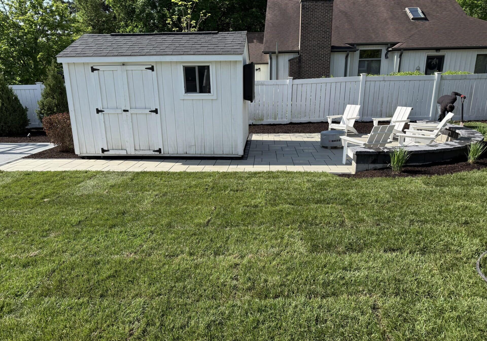 Backyard with shed and patio seating